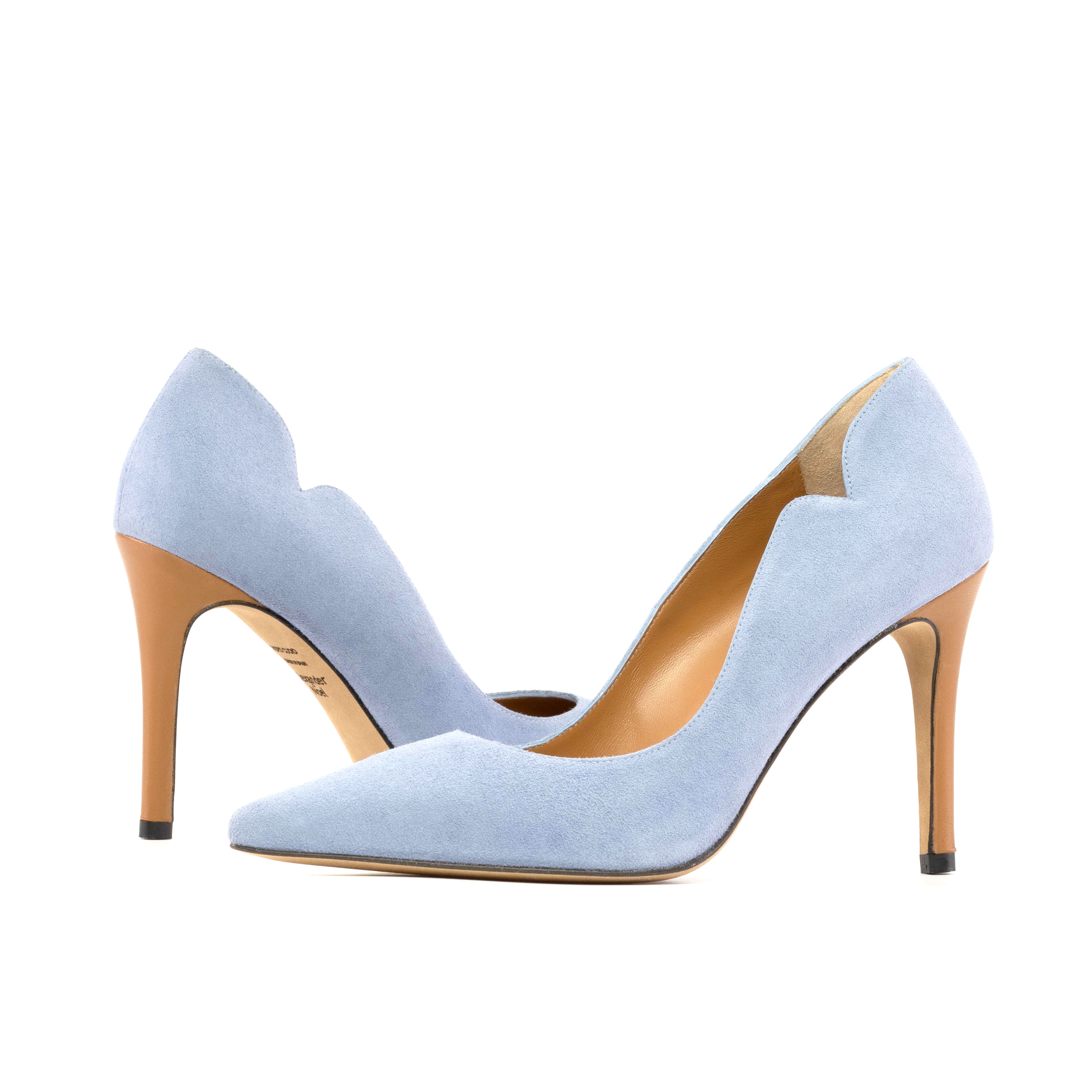 Premium Photo | Pare of light blue high heel shoes on pink background